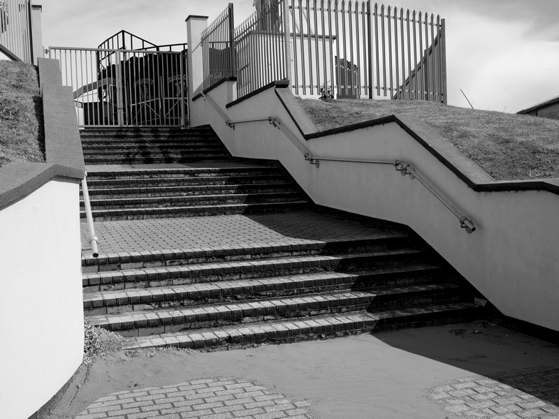 Stairs and railings with shadows